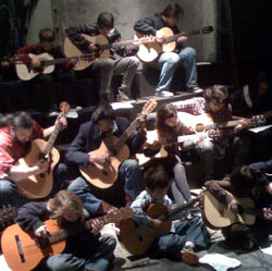 The acoustic guitar ensemble rehearses.